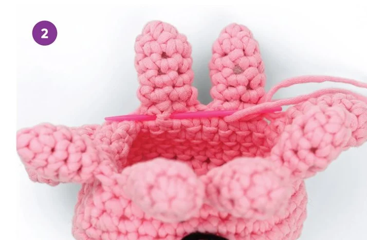 See the pouch opening beneath the crocheted body